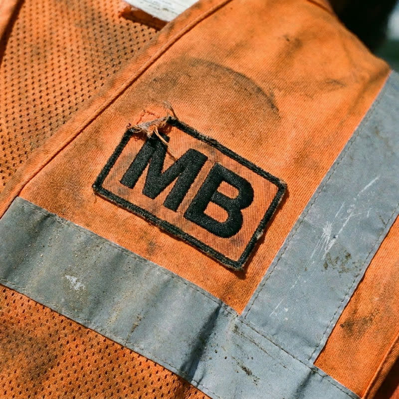 The McBean Builders patch stitched on a work vest